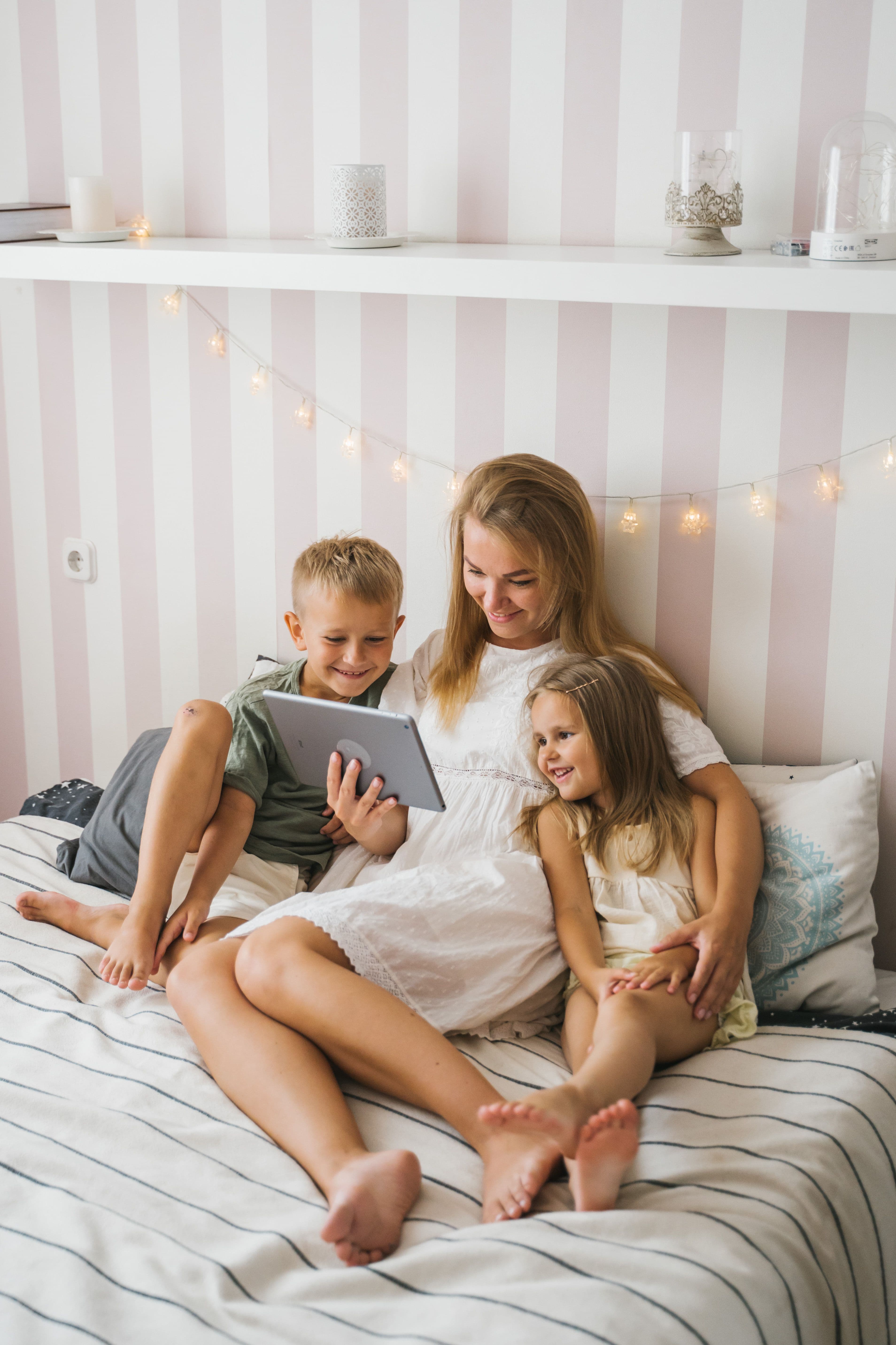 Mom reading family stories with her children