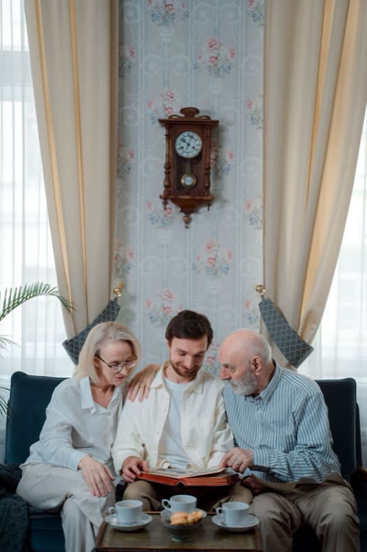 Family reading a printed KinWise storybook together